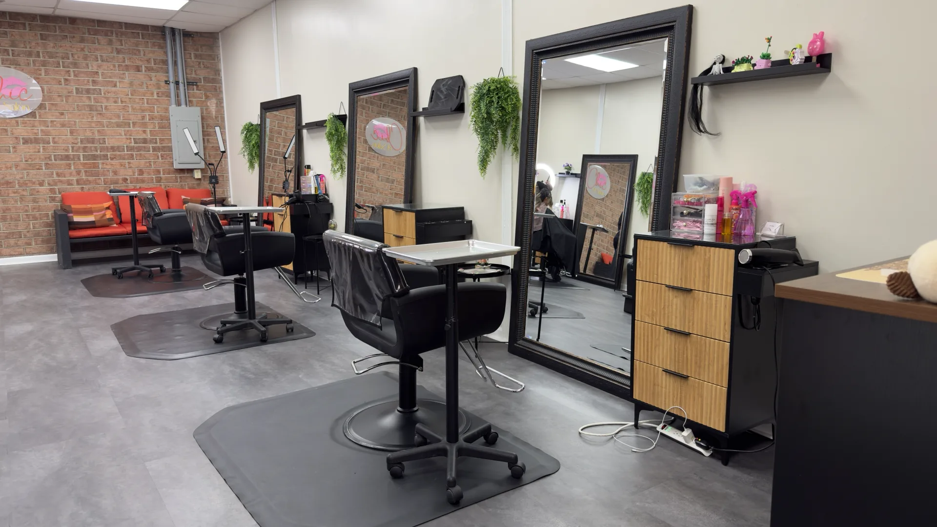 Styling stations with large mirrors at Chic El Salon in Charlotte, NC after the restructuring