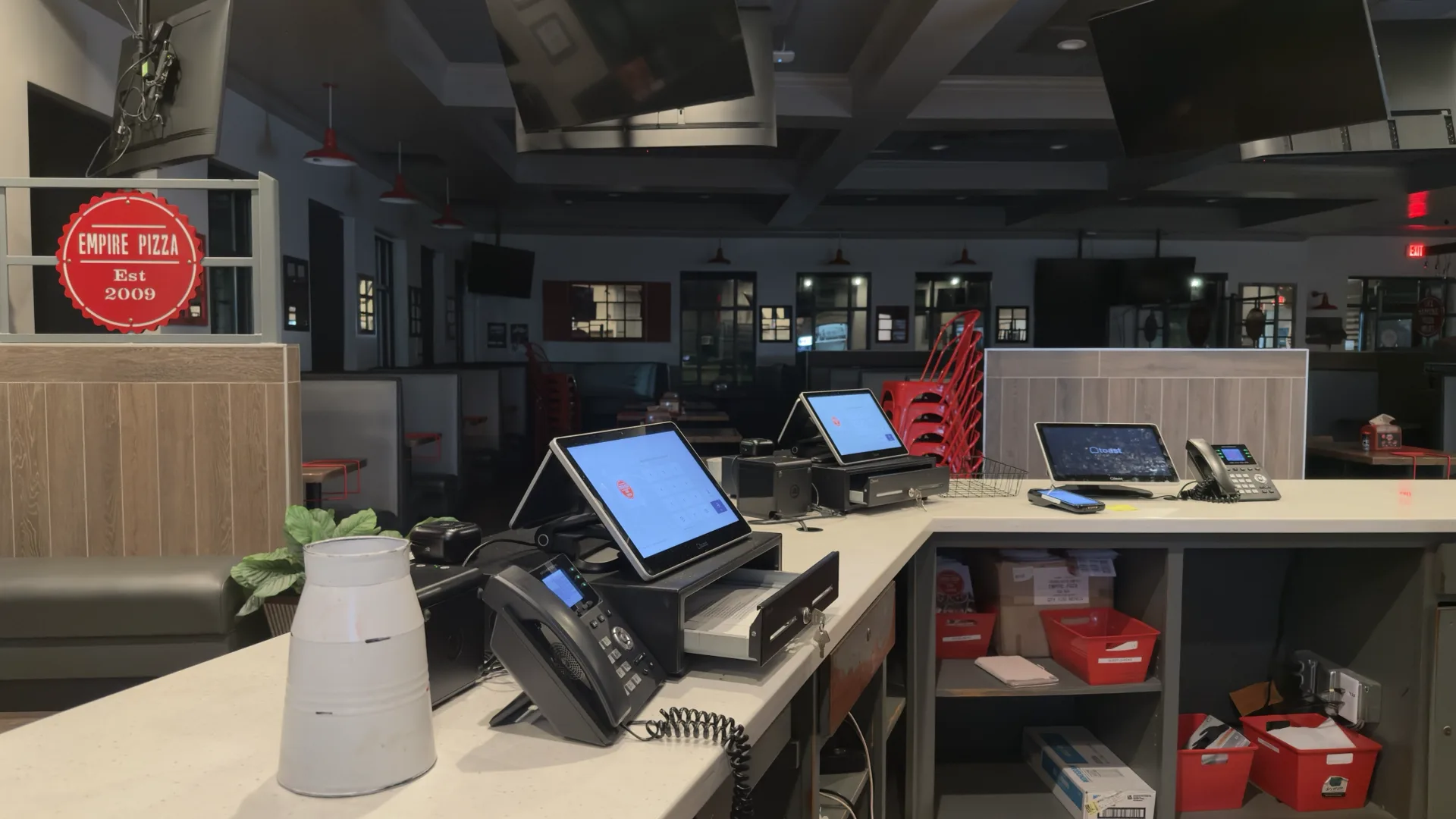 Front counter at Empire Pizza Mint Hill with Toast POS terminals and IP phones back online