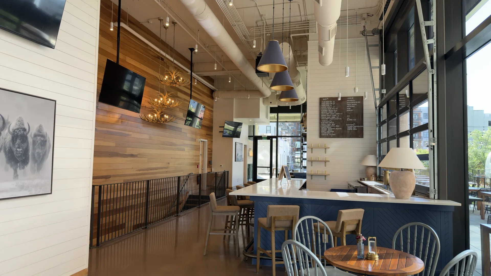 Interior of Club West Charlotte showing the bar and seating area in a polished guest-facing venue environment