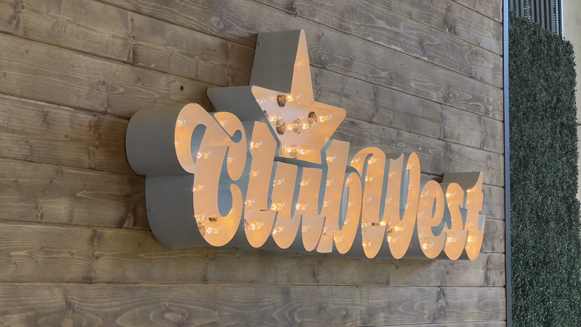 Illuminated Club West Charlotte sign in Charlotte, NC after Royal Nerds completed network cabling, CCTV, audio, and Square POS infrastructure
