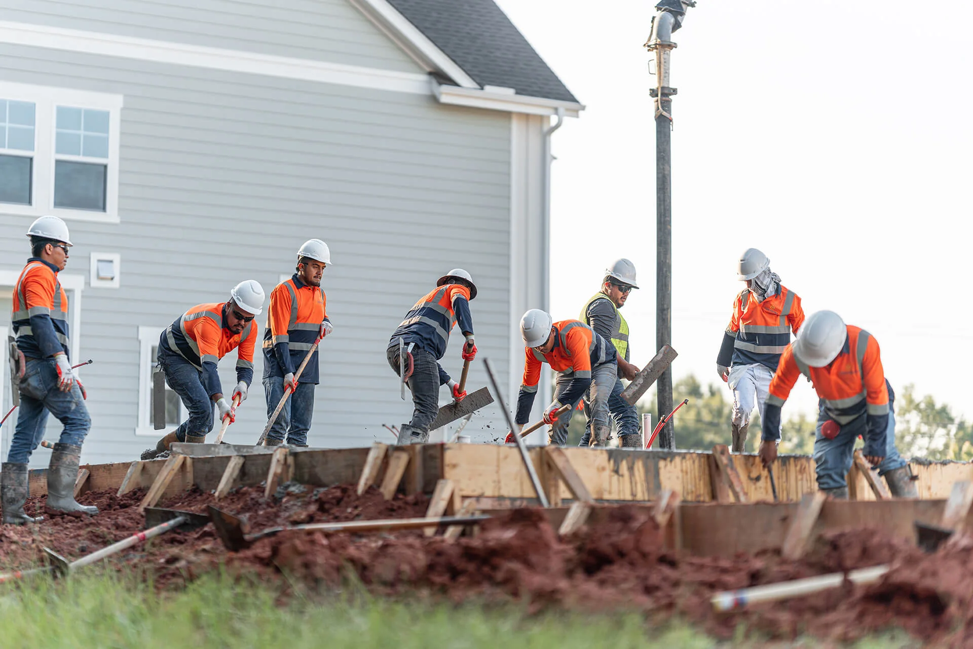 Concrete construction crew working together on a Concremex project