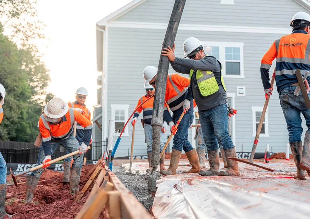 Concremex crew pouring and finishing concrete on a residential job site